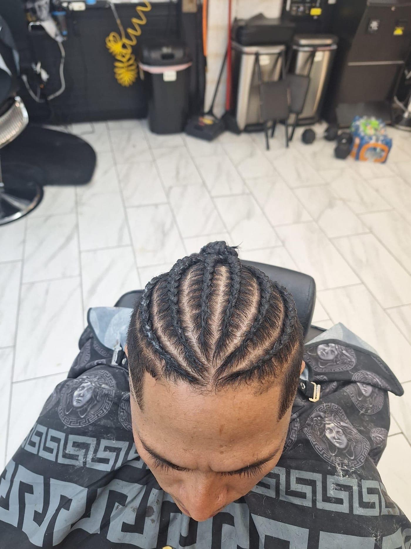 Straight-back braids by The Fade Crew